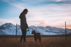 A woman walking with her dog